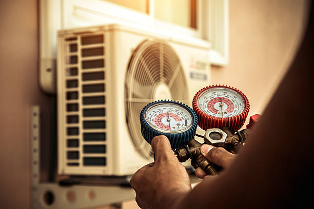 Professional Heat Pump Repair technician working in Boxford, MA